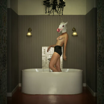 Portrait of a unicorn woman in the bathroom