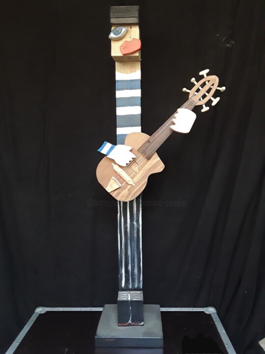 Sculpture intitulée "Jano à la guitare" par Caroline Cavalier, Œuvre d'art originale, Bois