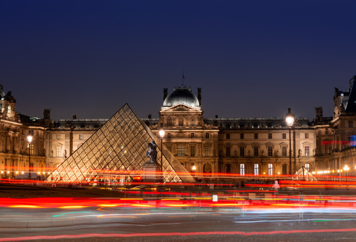 Two archaeologists, including a Louvre curator, are detained by French authorities as part of an ongoing international art-trafficking dragnet
